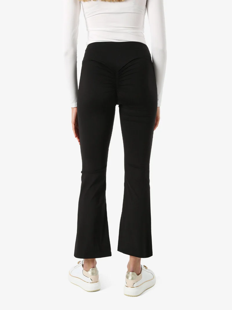 Leggings donna a zampa con arricciatura posteriore effetto push-up - nero