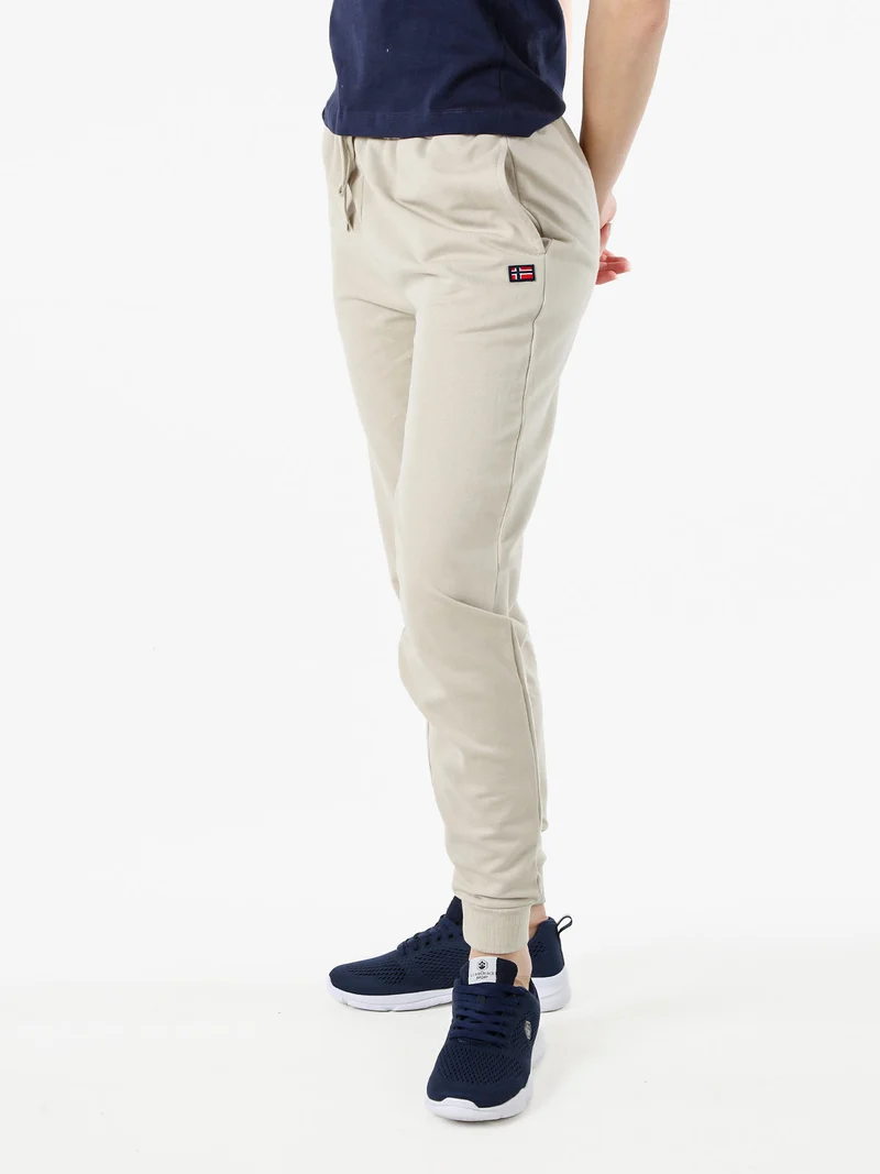 Pantaloni tuta da donna in cotone con coulisse e polsini - beige