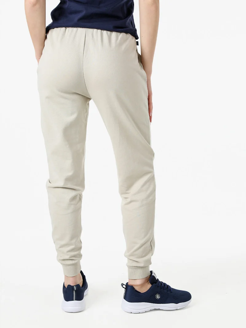 Pantaloni tuta da donna in cotone con coulisse e polsini - beige