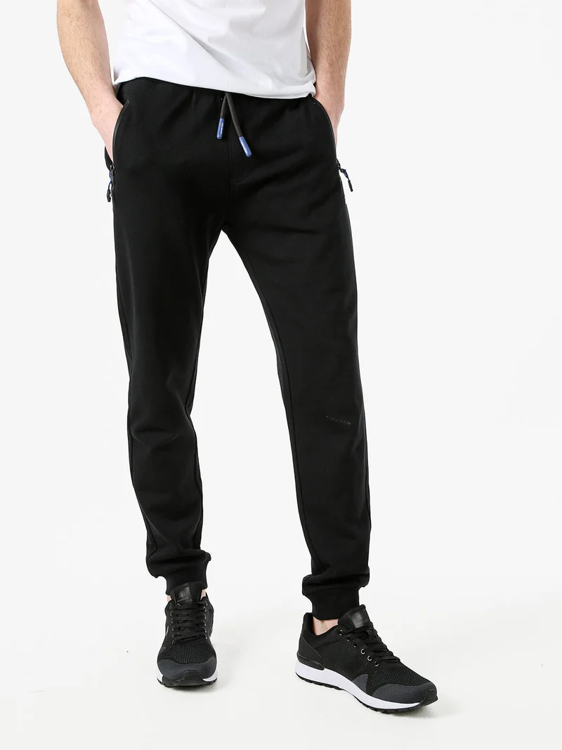 Pantaloni tuta da uomo con coulisse e polsini - nero
