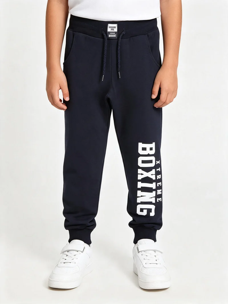 Pantaloni sportivi da ragazzo con coulisse e polsini - blu scuro