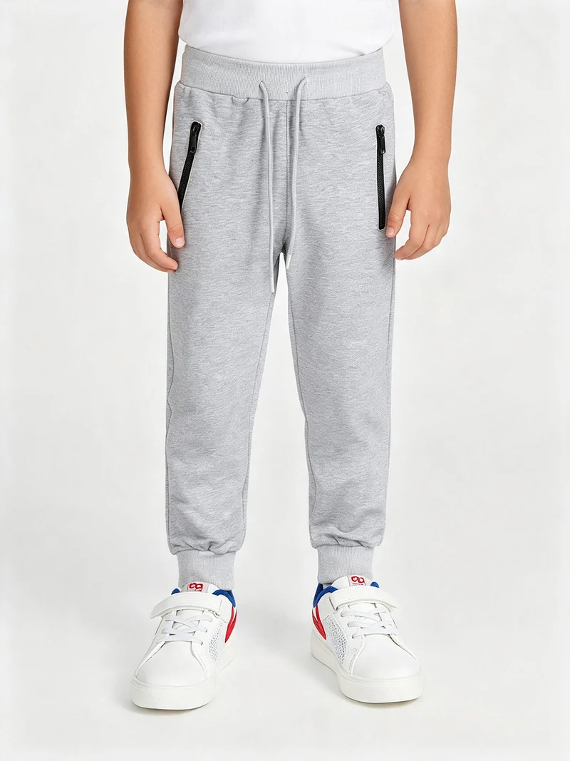 Pantaloni tuta da bambino con polsini e coulisse - grigio
