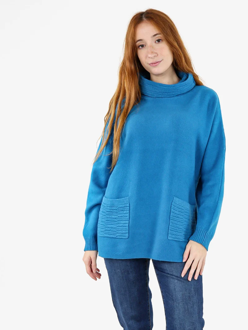 Maglione dolcevita da donna con tasche sul fondo - turchese