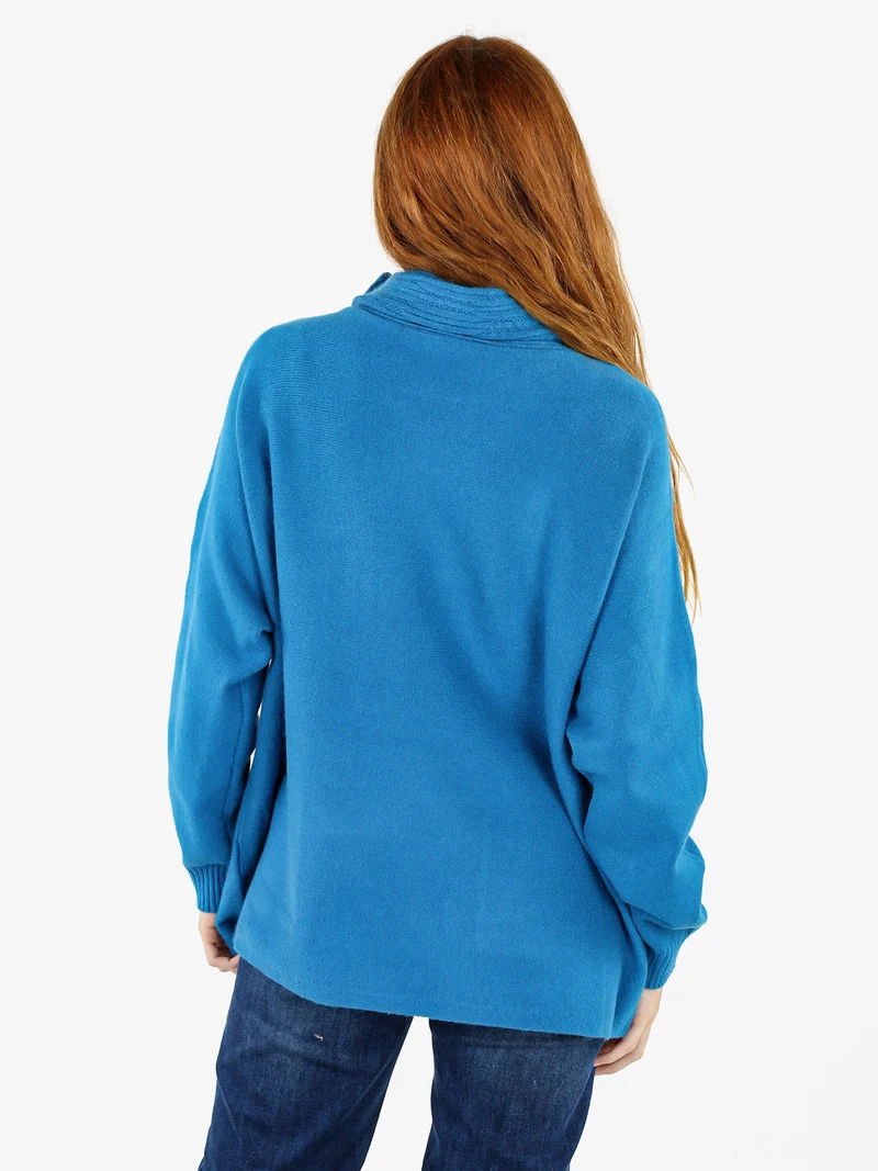 Maglione dolcevita da donna con tasche sul fondo - turchese