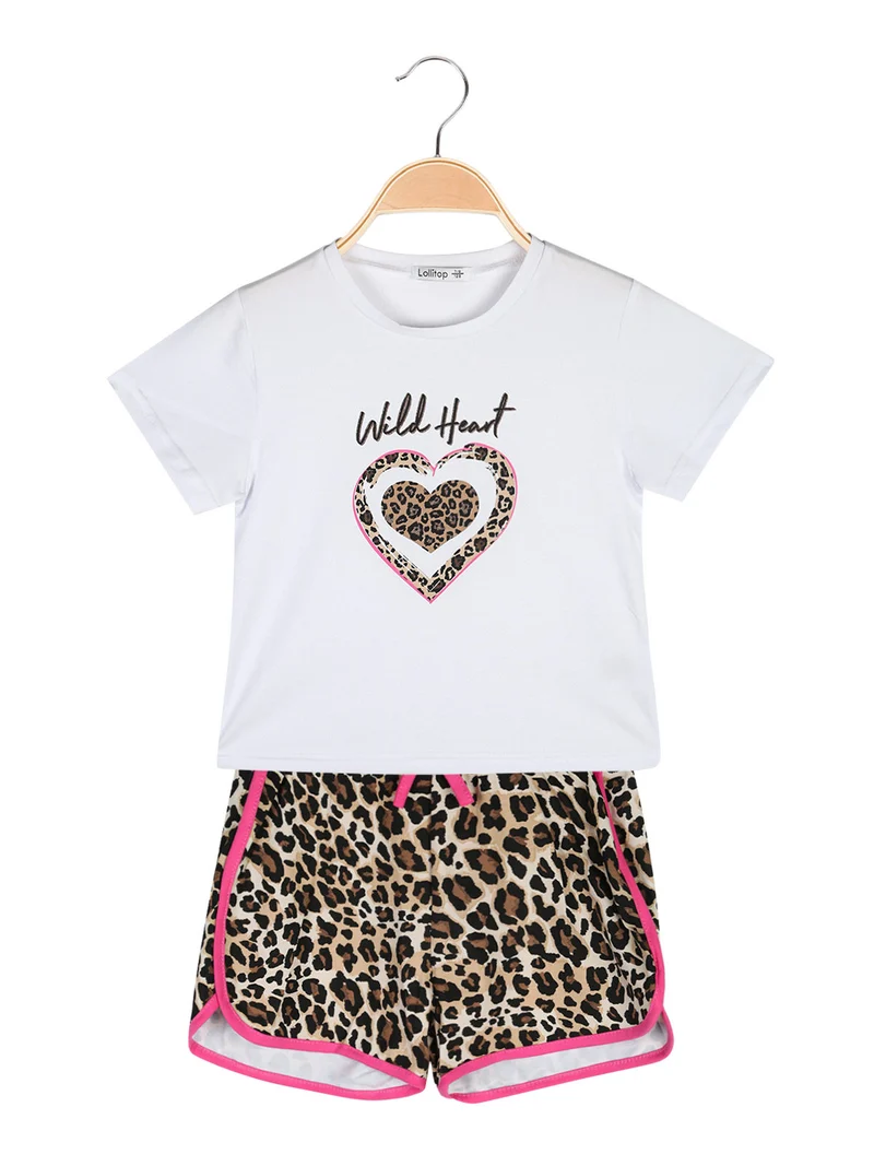 Completo corto da bambina con t-shirt crop e shorts maculati - fucsia