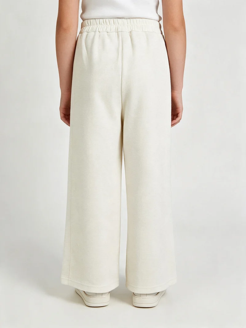 Pantaloni da bambina in maglia con elastico in vita - panna