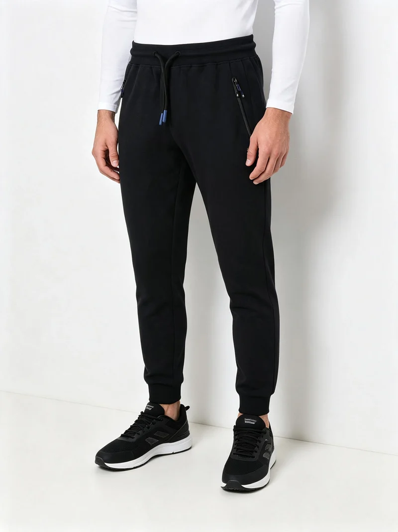 Pantaloni tuta da uomo con coulisse e polsini - blu scuro