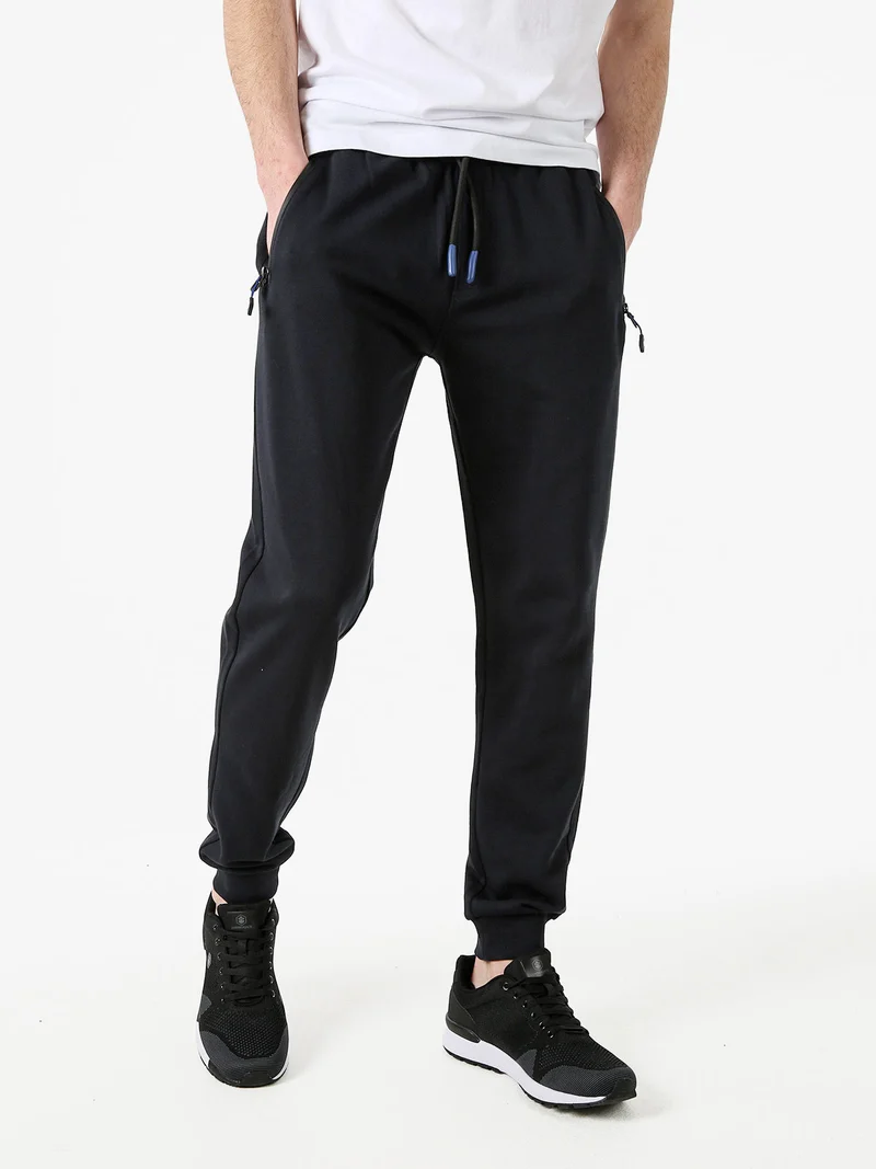 Pantaloni tuta da uomo con coulisse e polsini - blu scuro