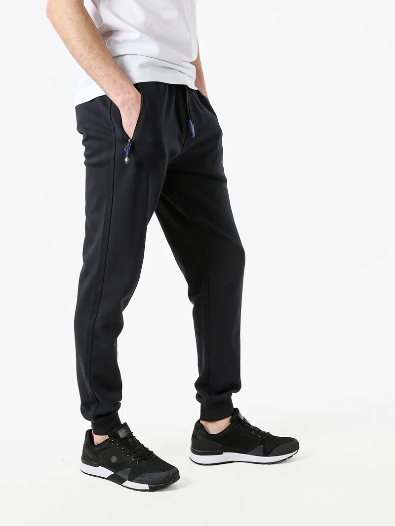 Pantaloni tuta da uomo con coulisse e polsini - blu scuro