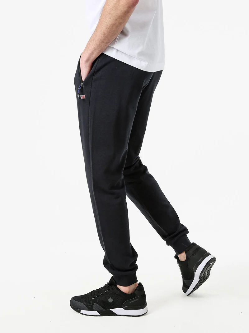 Pantaloni tuta da uomo con coulisse e polsini - blu scuro