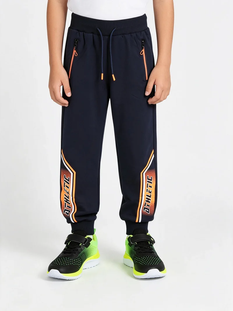 Pantaloni tuta da ragazzo con polsini e interno felpato - blu scuro