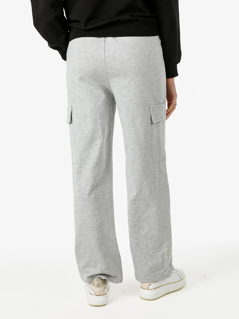 Pantaloni tuta da donna con tasconi a gamba dritta - grigio