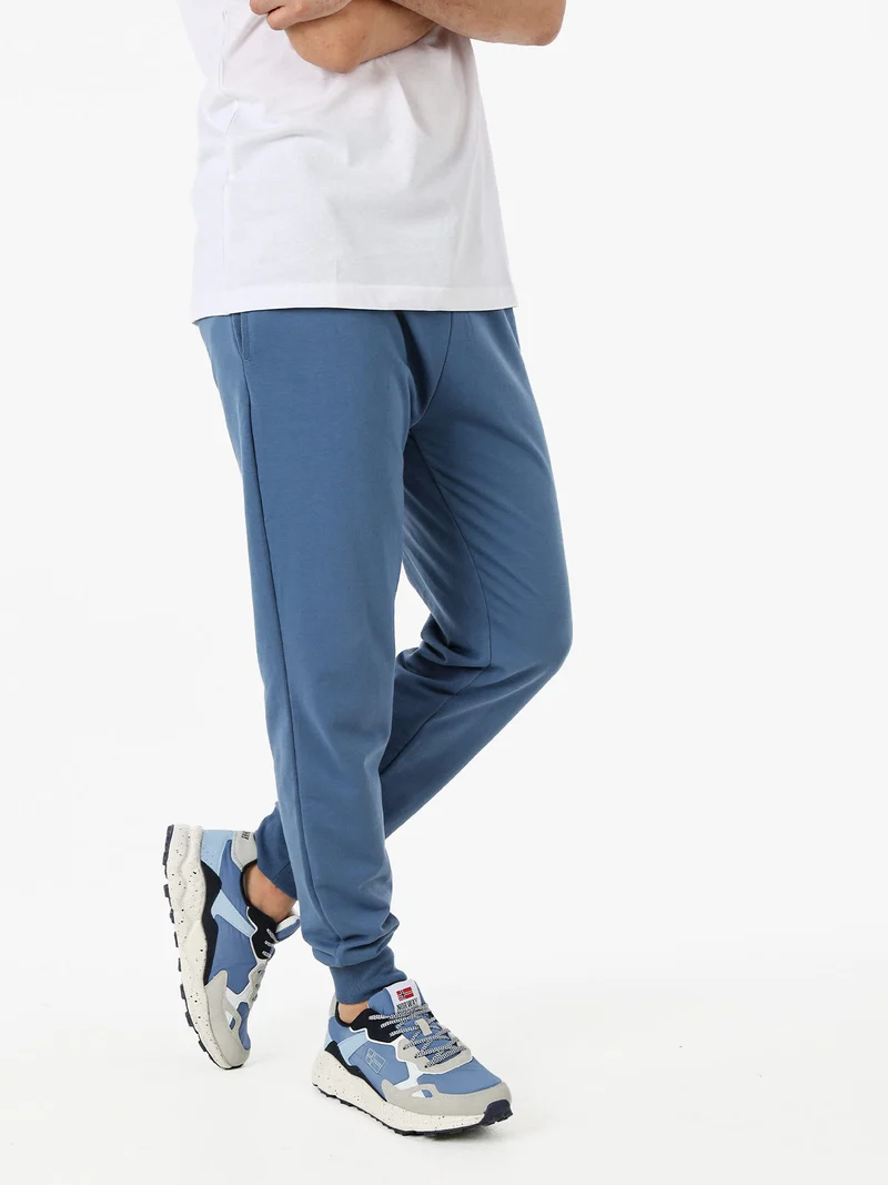 Pantaloni tuta da uomo in cotone con coulisse e polsini - blu