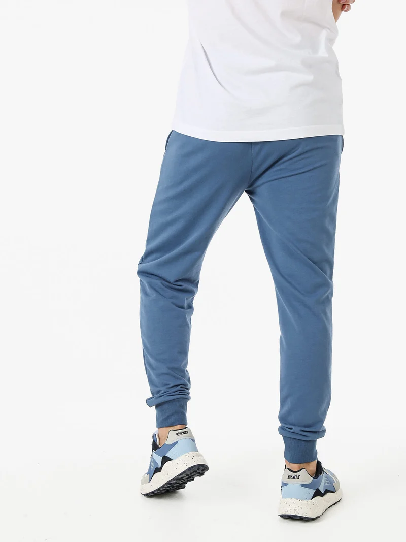 Pantaloni tuta da uomo in cotone con coulisse e polsini - blu