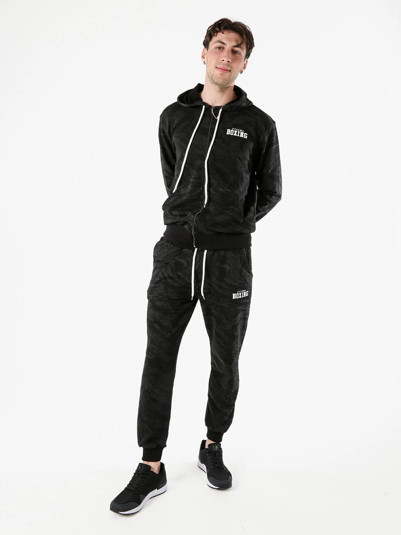 Pantaloni tuta da uomo in cotone con stampe e polsini - nero