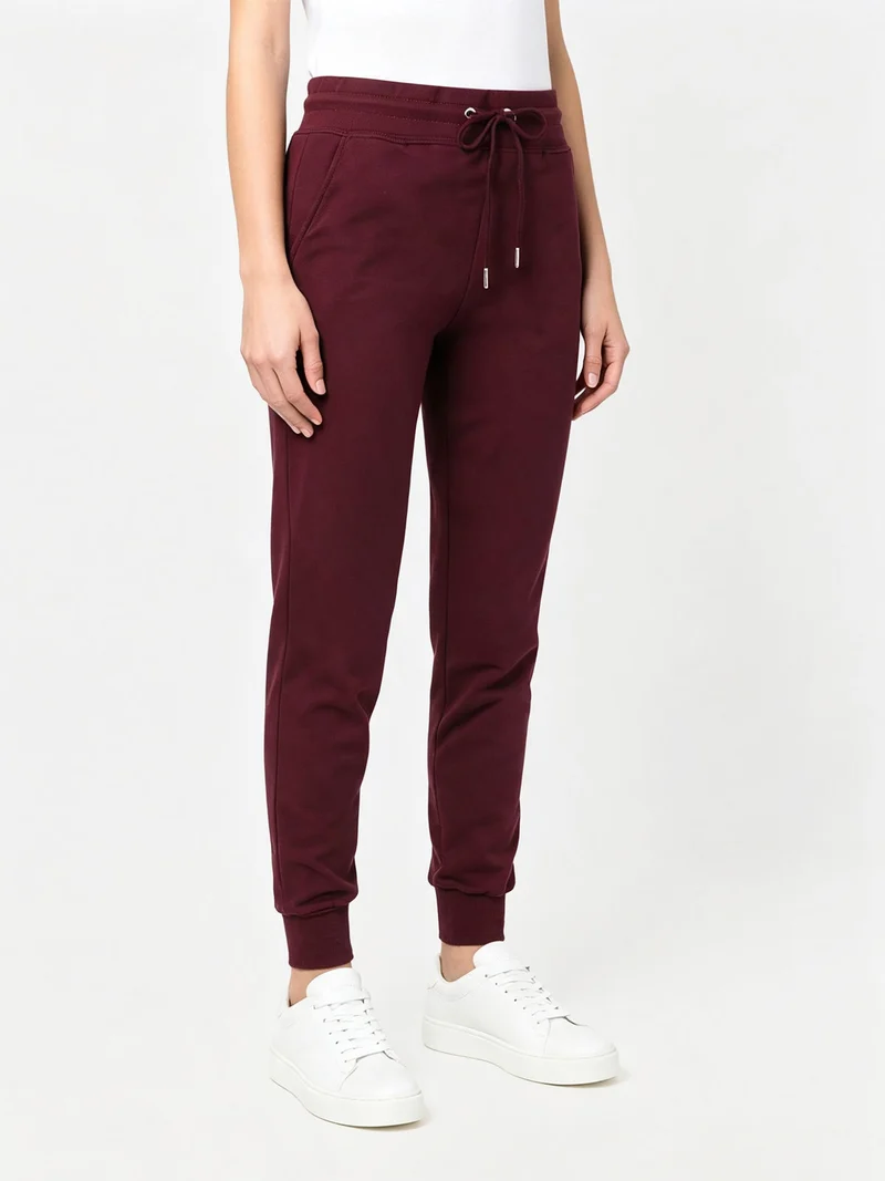 Pantaloni tuta da donna in cotone con coulisse e polsini - bordeaux