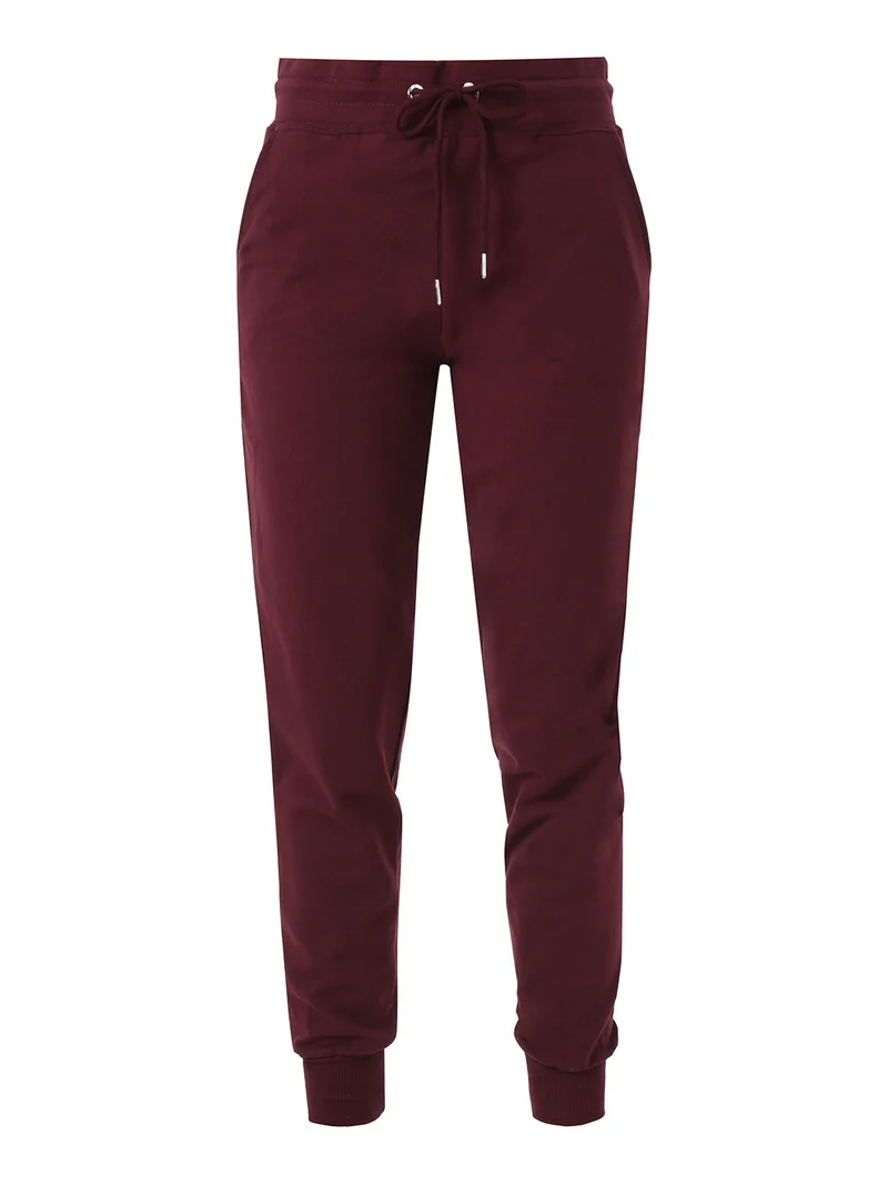 Pantaloni tuta da donna in cotone con coulisse e polsini - bordeaux