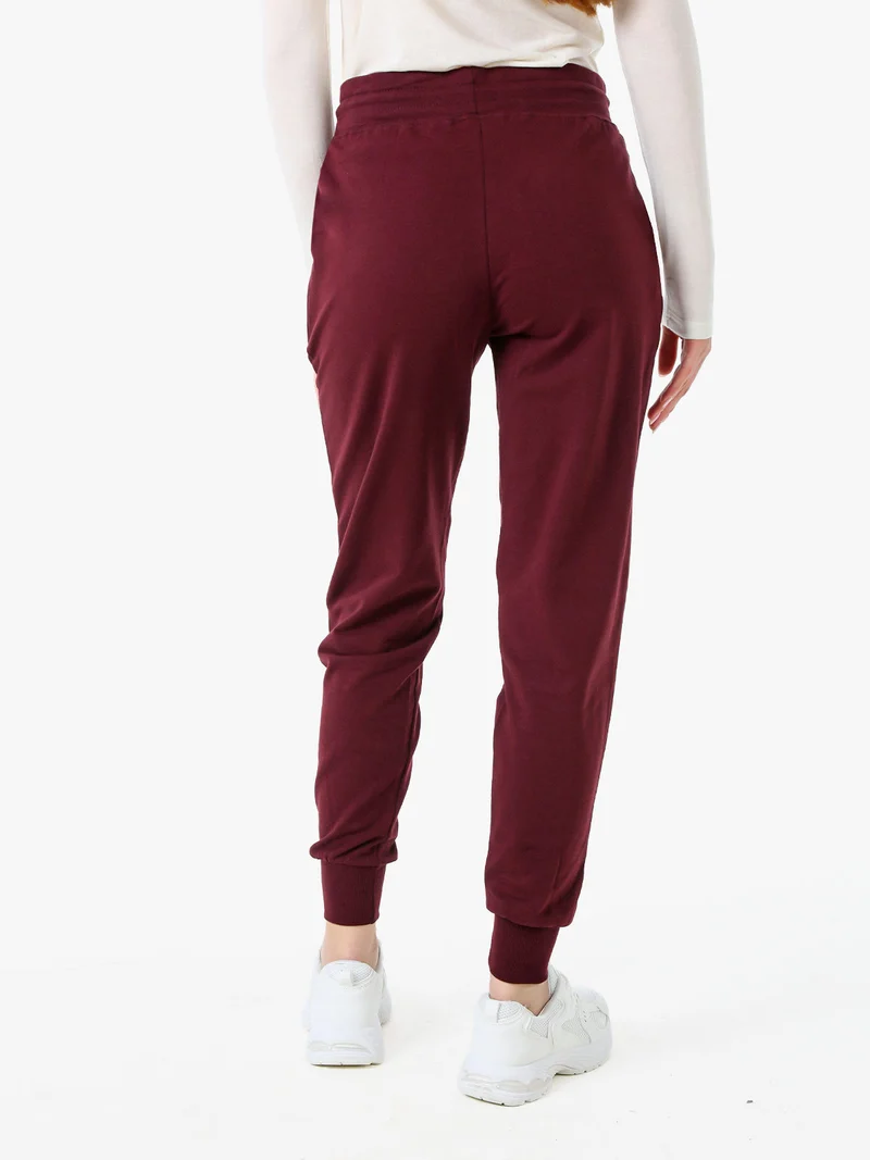 Pantaloni tuta da donna in cotone con coulisse e polsini - bordeaux