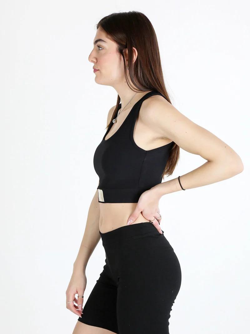 Top donna sportivo a costine con coppe imbottite - nero
