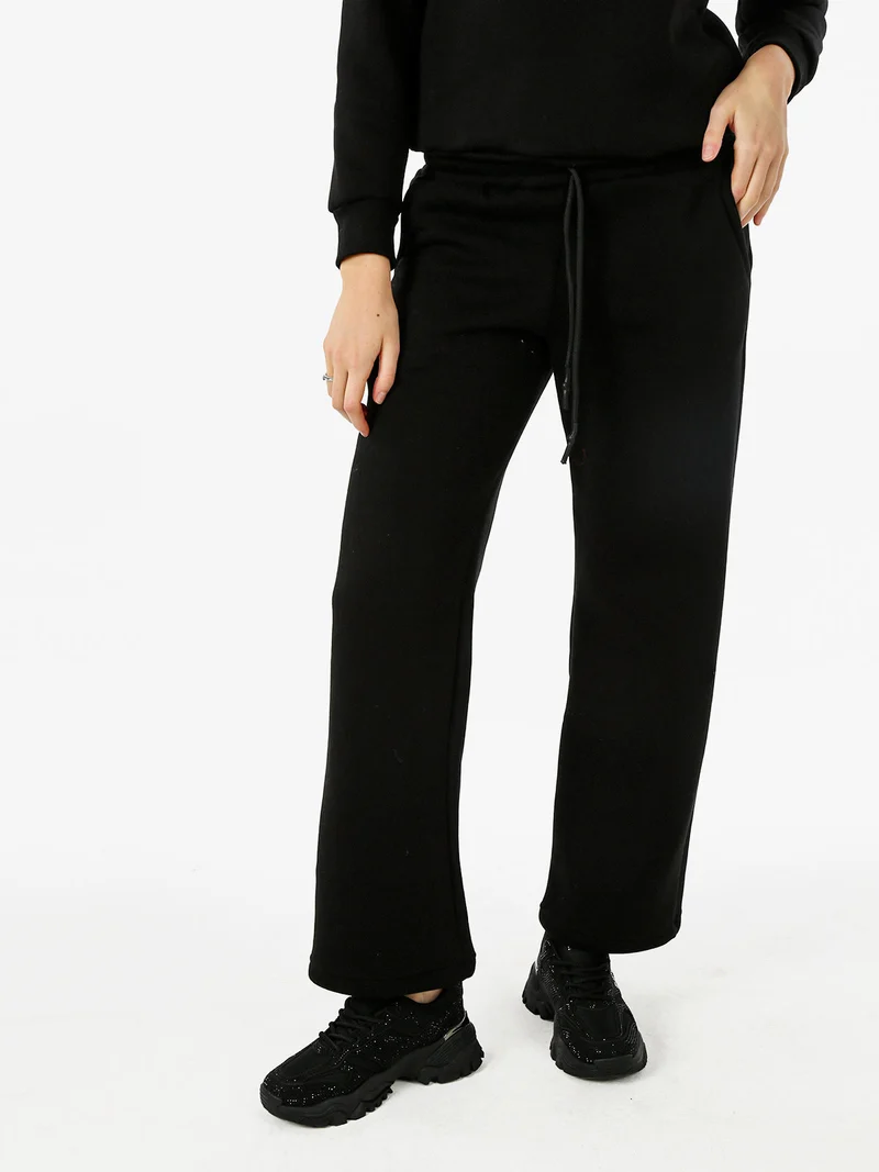 Pantaloni da donna in felpa a gamba larga con coulisse - nero