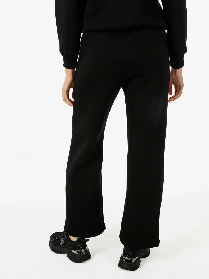 Pantaloni da donna in felpa a gamba larga con coulisse - nero