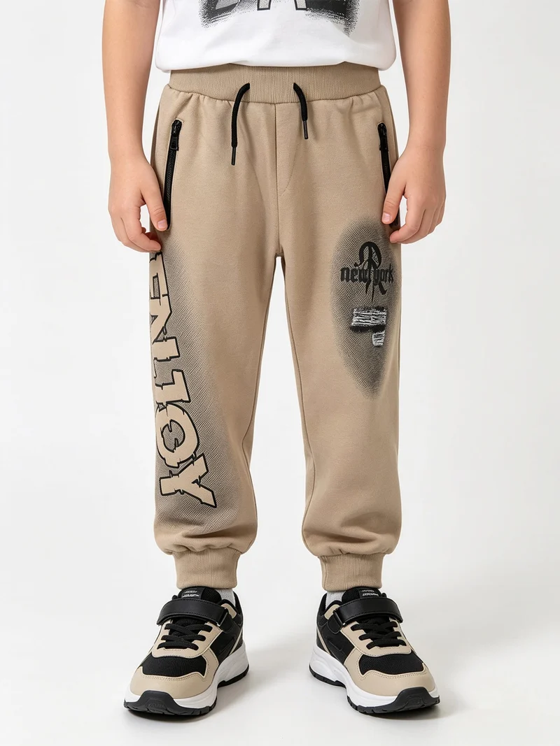 Pantaloni tuta da bambino con polsini e interno caldo - khaki