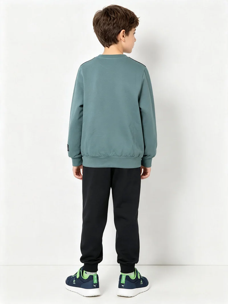 Completo tuta da ragazzo in cotone con felpa girocollo e pantaloni con polsini - acqua marina