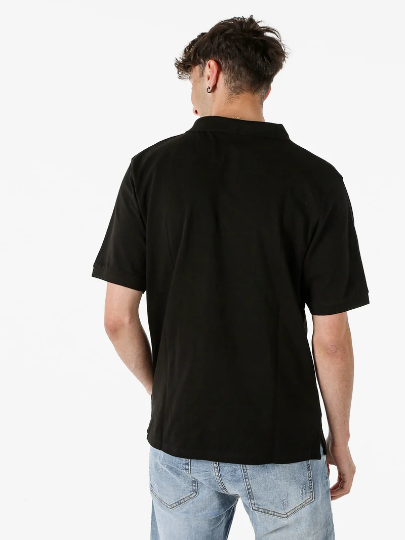 Polo da uomo in cotone piquet a maniche corte - nero