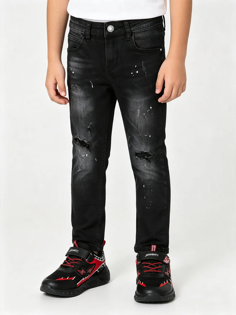 Jeans skinny da ragazzo con strappi - nero