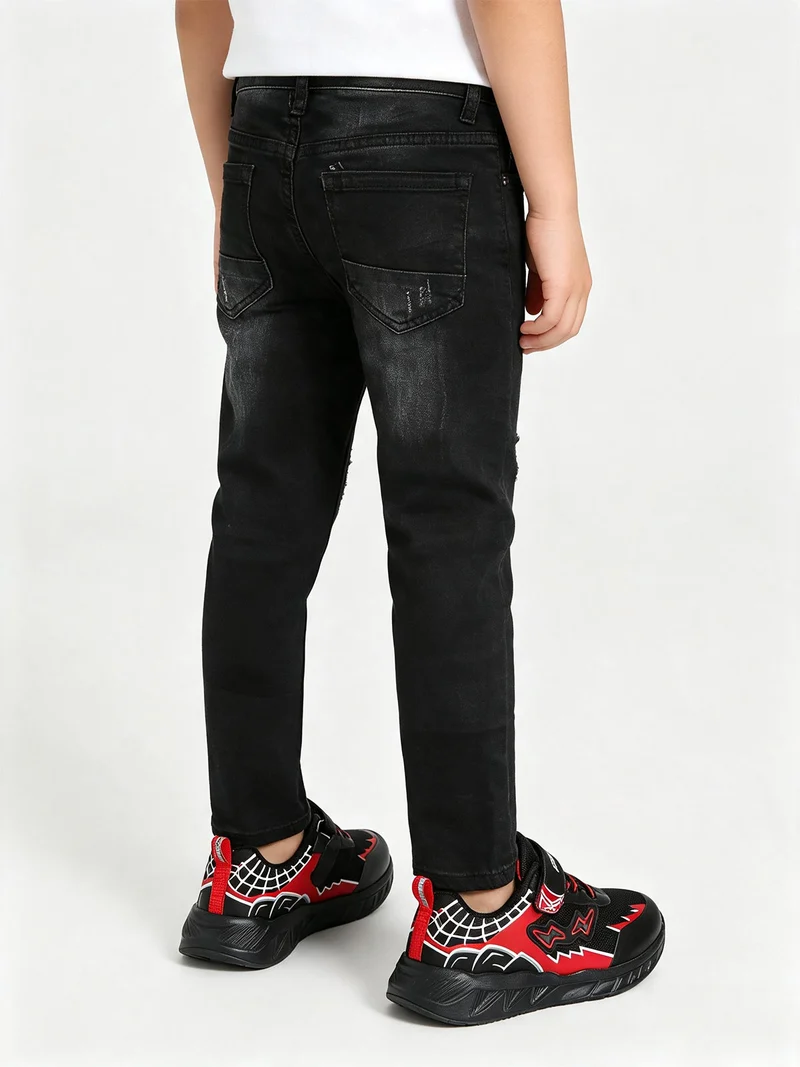 Jeans skinny da ragazzo con strappi - nero
