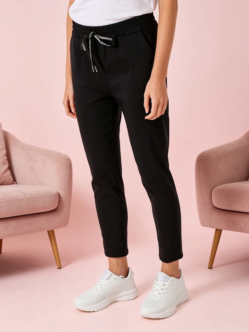 Pantaloni donna elasticizzati con coulisse - nero