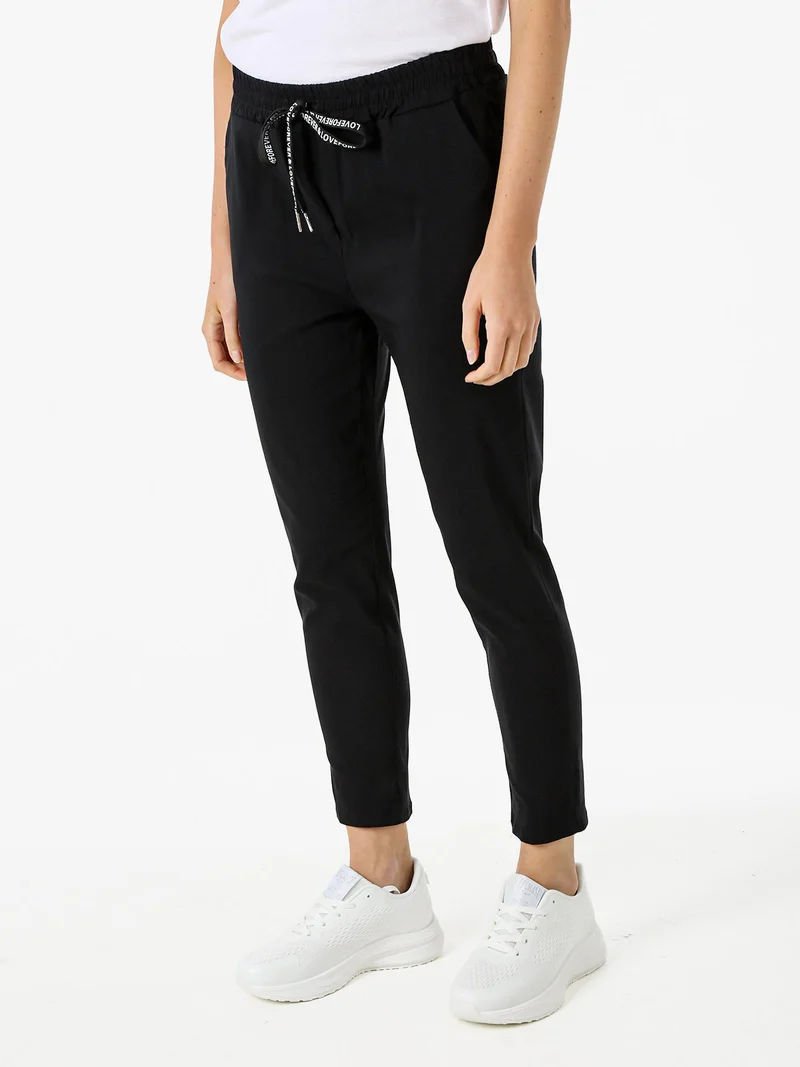 Pantaloni donna elasticizzati con coulisse - nero