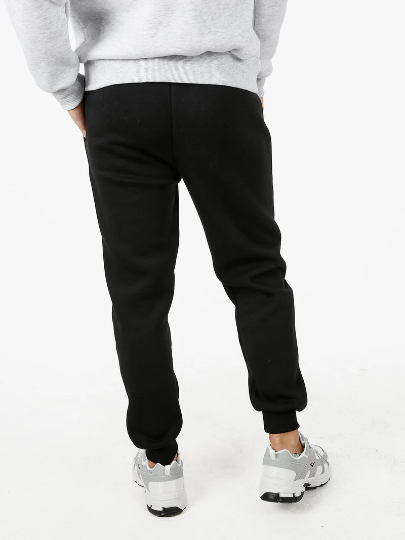 Pantaloni tuta da uomo felpati con logo - nero