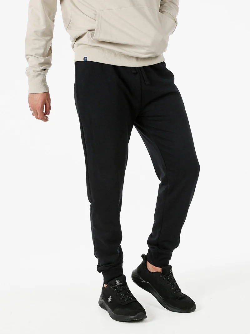 Pantaloni tuta da uomo in cotone con coulisse e polsini - nero