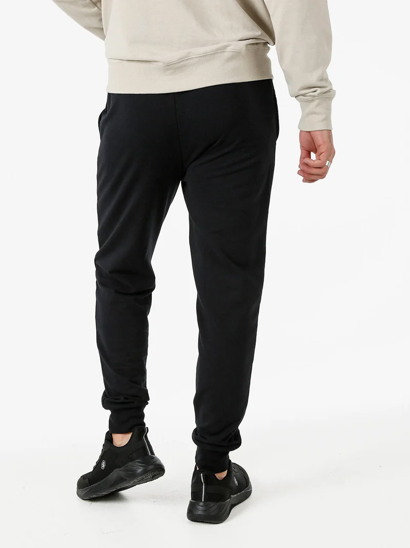 Pantaloni tuta da uomo in cotone con coulisse e polsini - nero