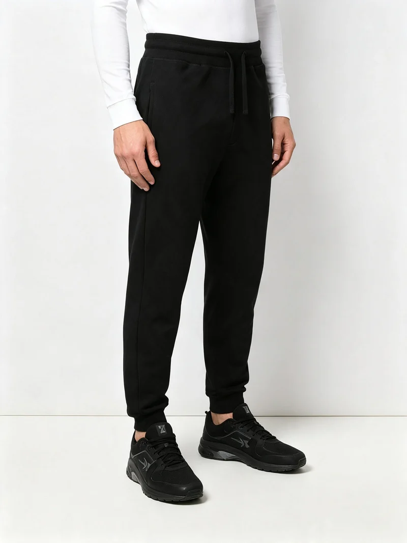 Pantaloni tuta da uomo con coulisse e polsini - nero