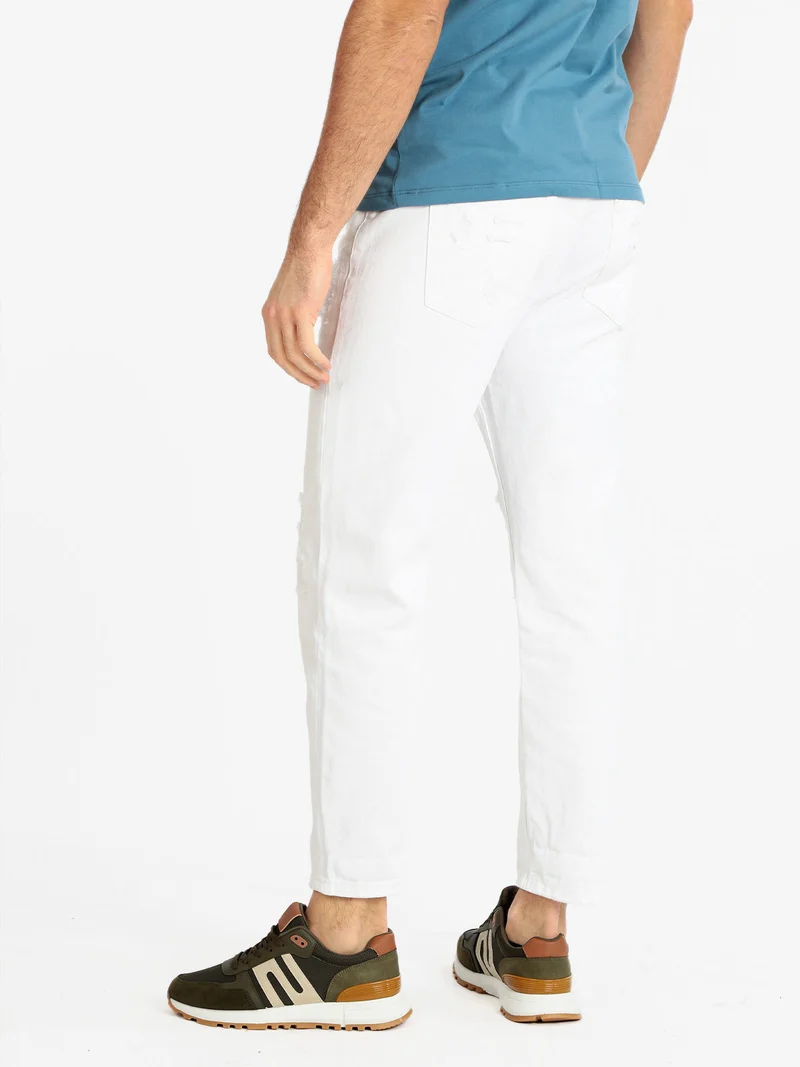 Pantaloni cropped uomo con strappi - bianco