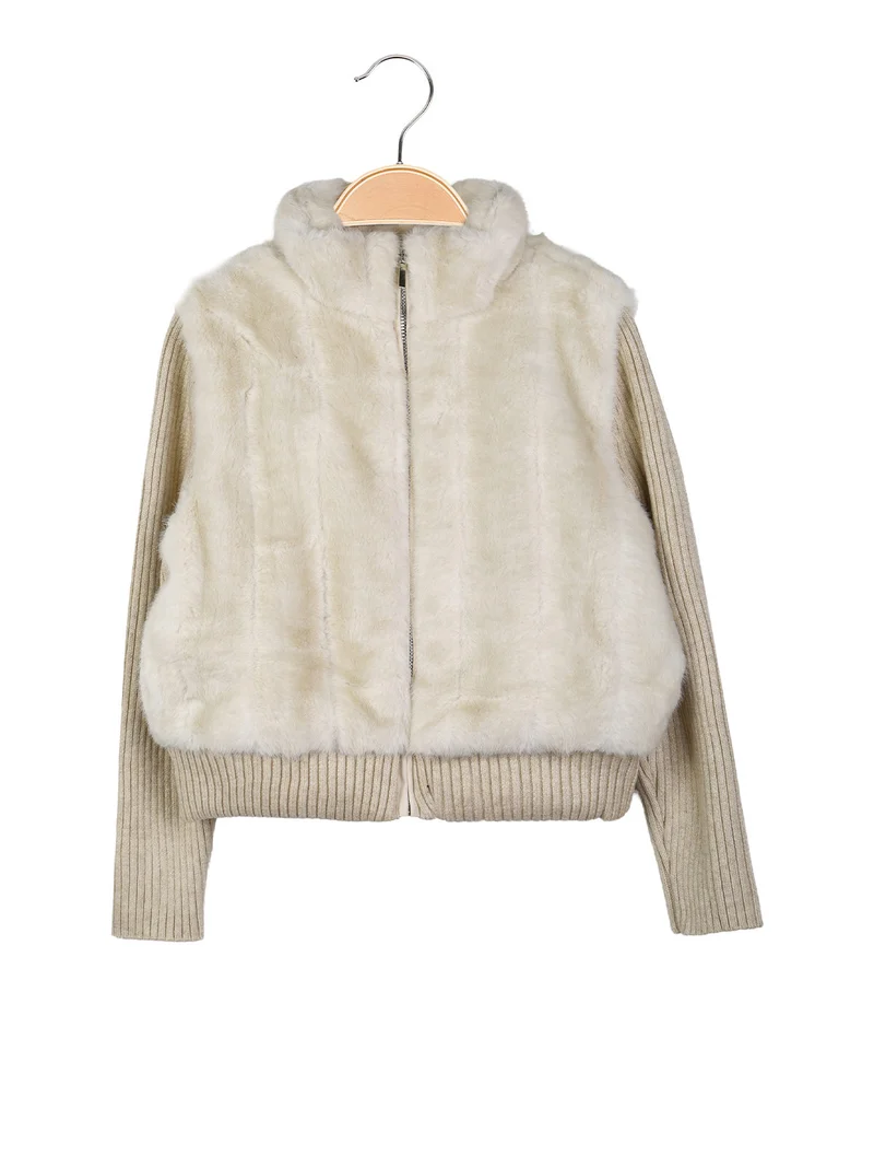 Giubbotto da bambina in ecopelliccia con maniche in maglia - beige
