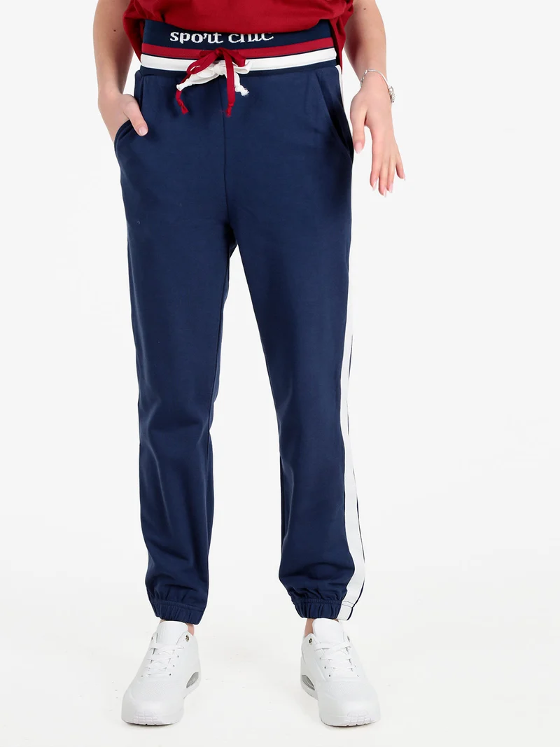 Pantaloni tuta da donna con coulisse e polsini - blu scuro