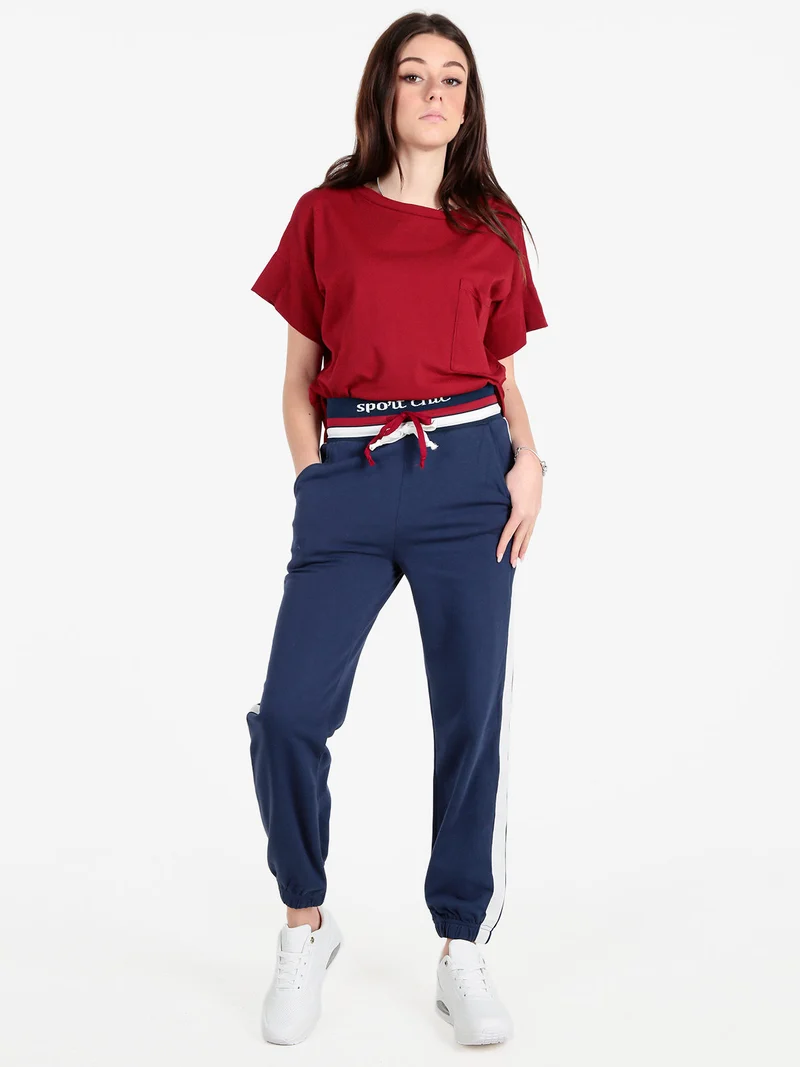 Pantaloni tuta da donna con coulisse e polsini - blu scuro
