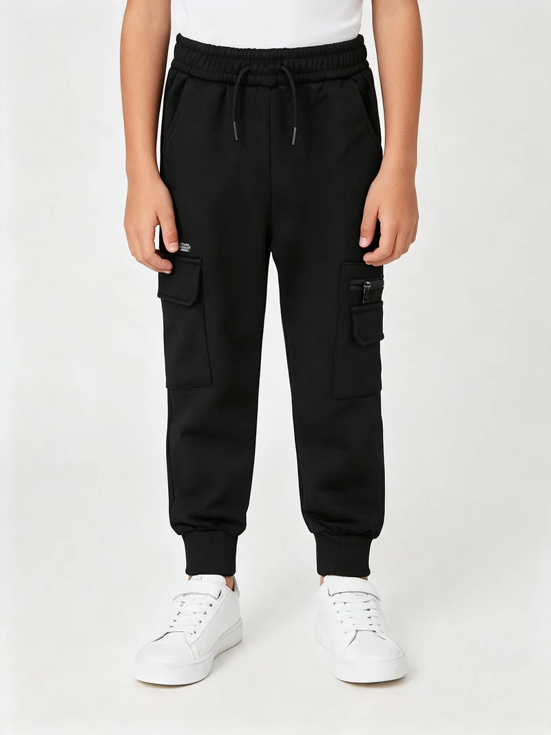 Pantaloni cargo da bambino con polsini e interno felpato - nero