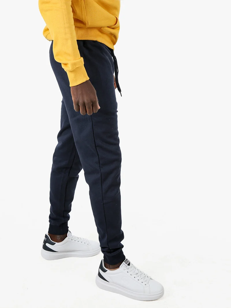 Pantaloni tuta da uomo con coulisse e polsini - blu scuro