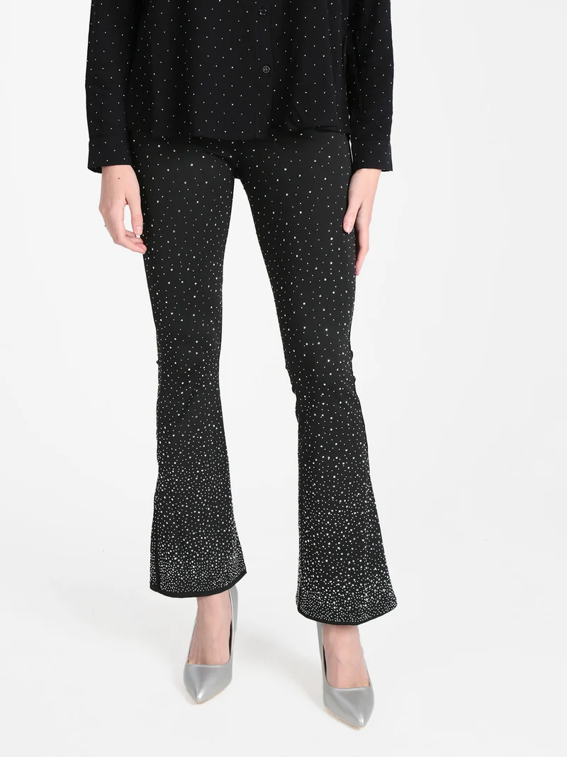 Pantaloni donna a zampa con borchie luccicanti - nero