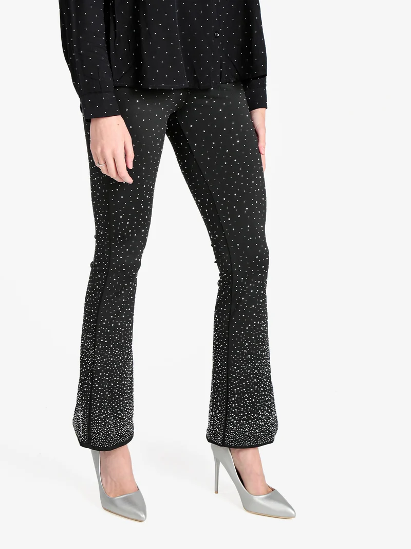 Pantaloni donna a zampa con borchie luccicanti - nero