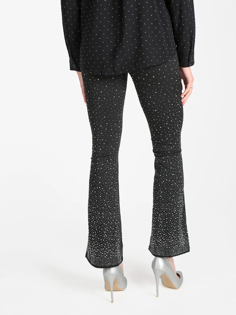 Pantaloni donna a zampa con borchie luccicanti - nero