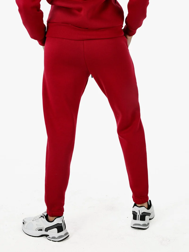 Pantaloni tuta da donna felpati con coulisse - bordeaux