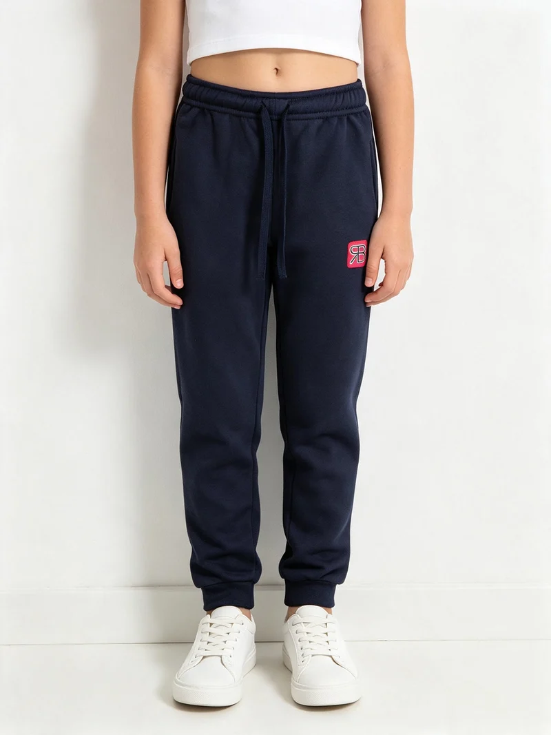 Pantaloni tuta felpati da bambina - fucsia