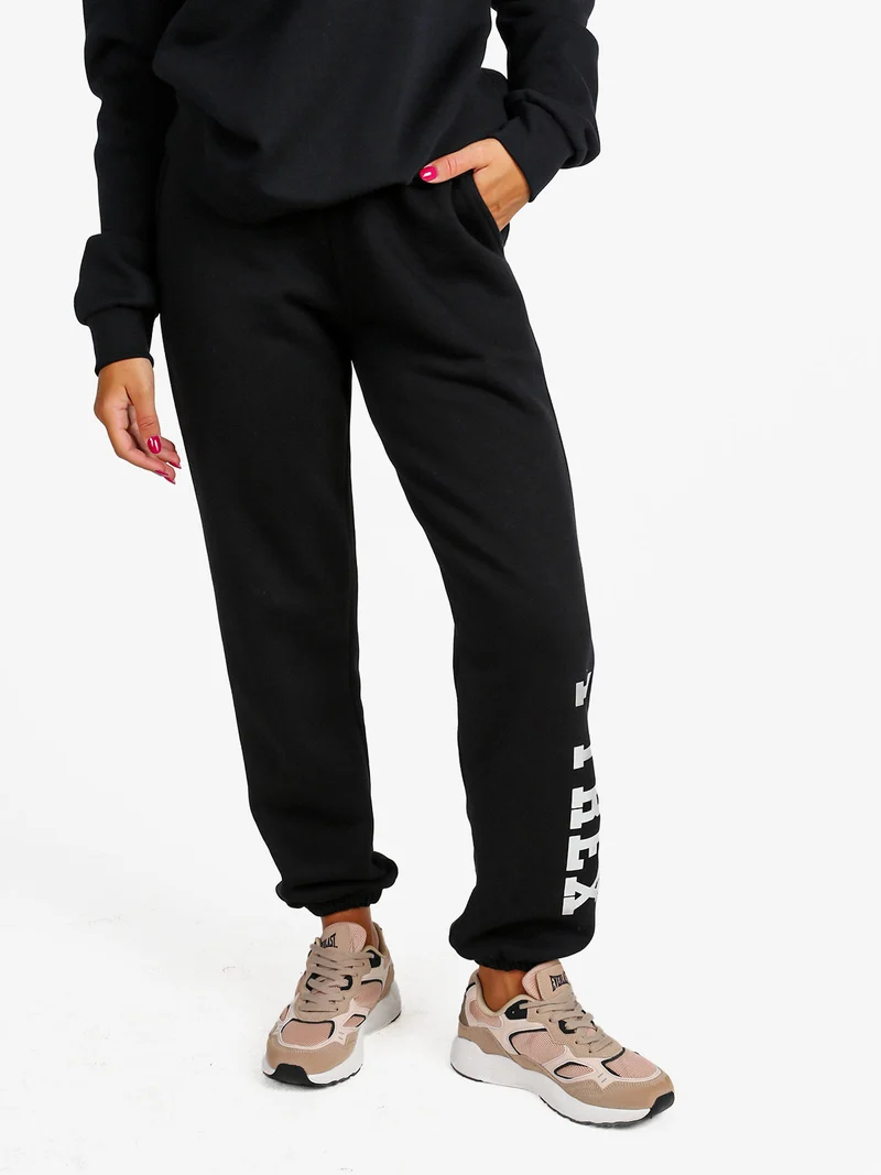 Pantaloni tuta da donna felpati con elastico finale - nero