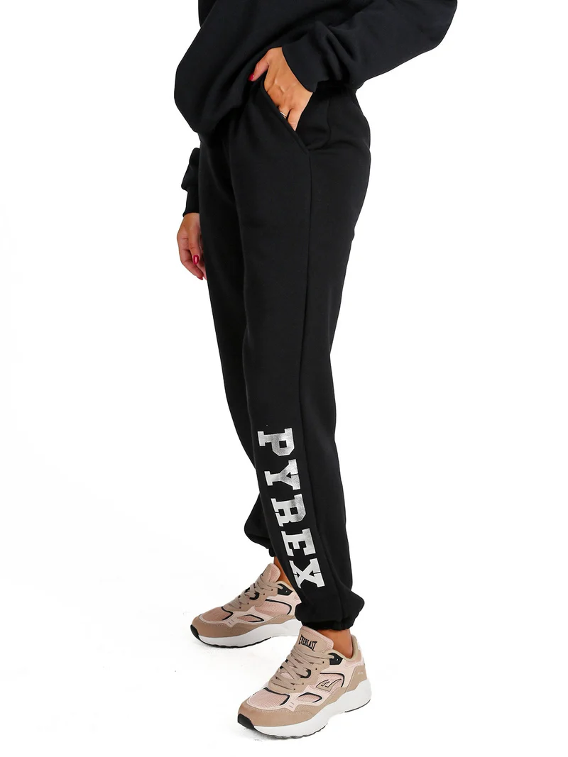 Pantaloni tuta da donna felpati con elastico finale - nero