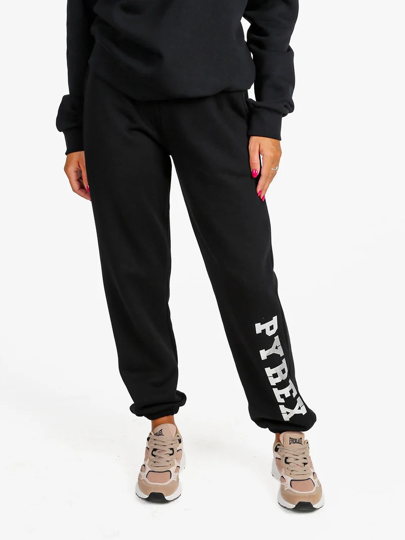 Pantaloni tuta da donna felpati con elastico finale - nero
